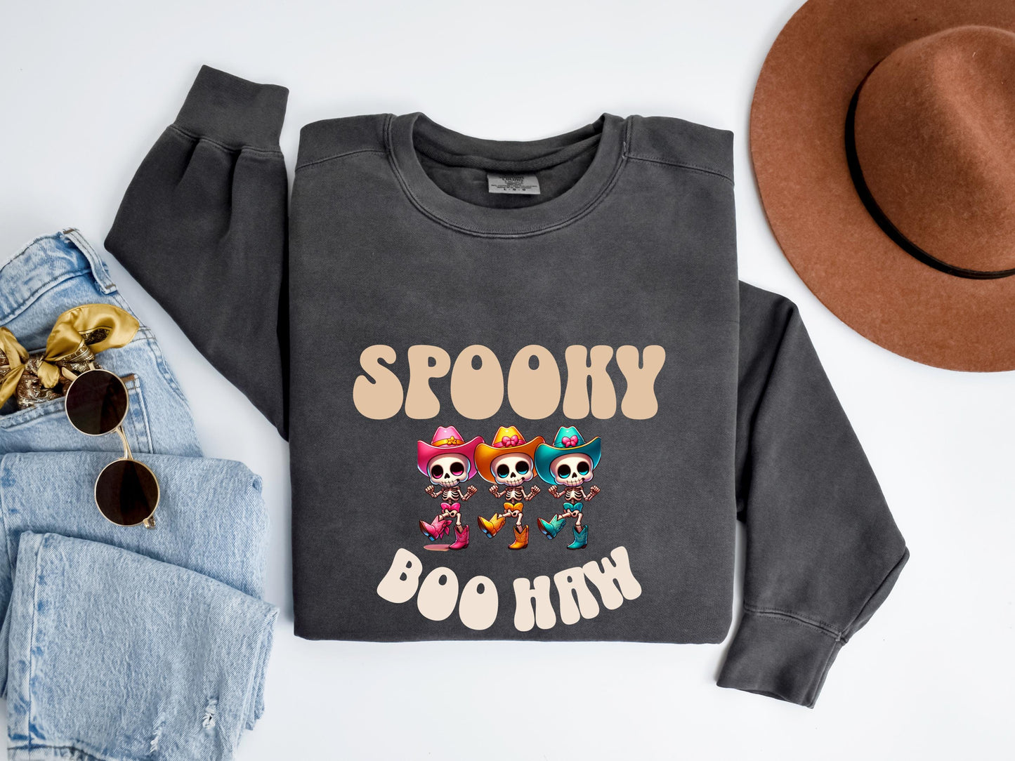 Get into the Halloween spirit with our Spooky Boo Haw Sweatshirt, a cute western ghost design. This cowboy top is perfect for spooky fun!